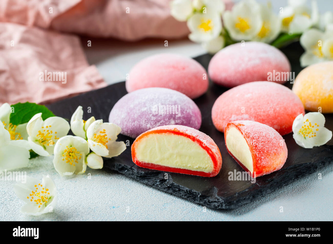 Multicolored Japanese ice cream Mochi in rice dough and Jasmine