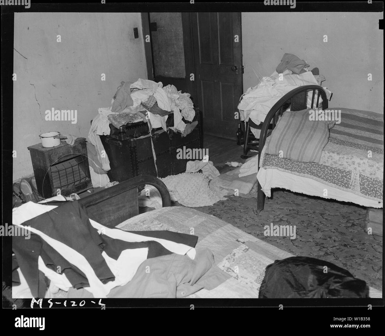 Bedroom of home of Mrs. Eloise Smith, widow of miner. Mrs. Smith lives in company housing project. Industrial Collieries Corporation, Barrackville #41 Mine, Barrackville, Marion County, West Virginia. Stock Photo