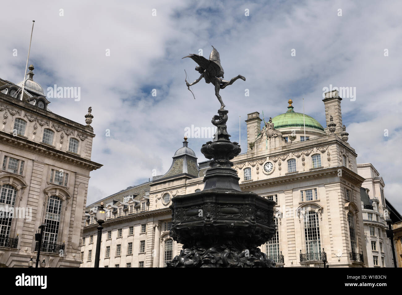Shaftesbury Memorial Fountain toped by statue of winged Anteros in Piccadilly Circus with The Quadrant on Regent street London England Stock Photo
