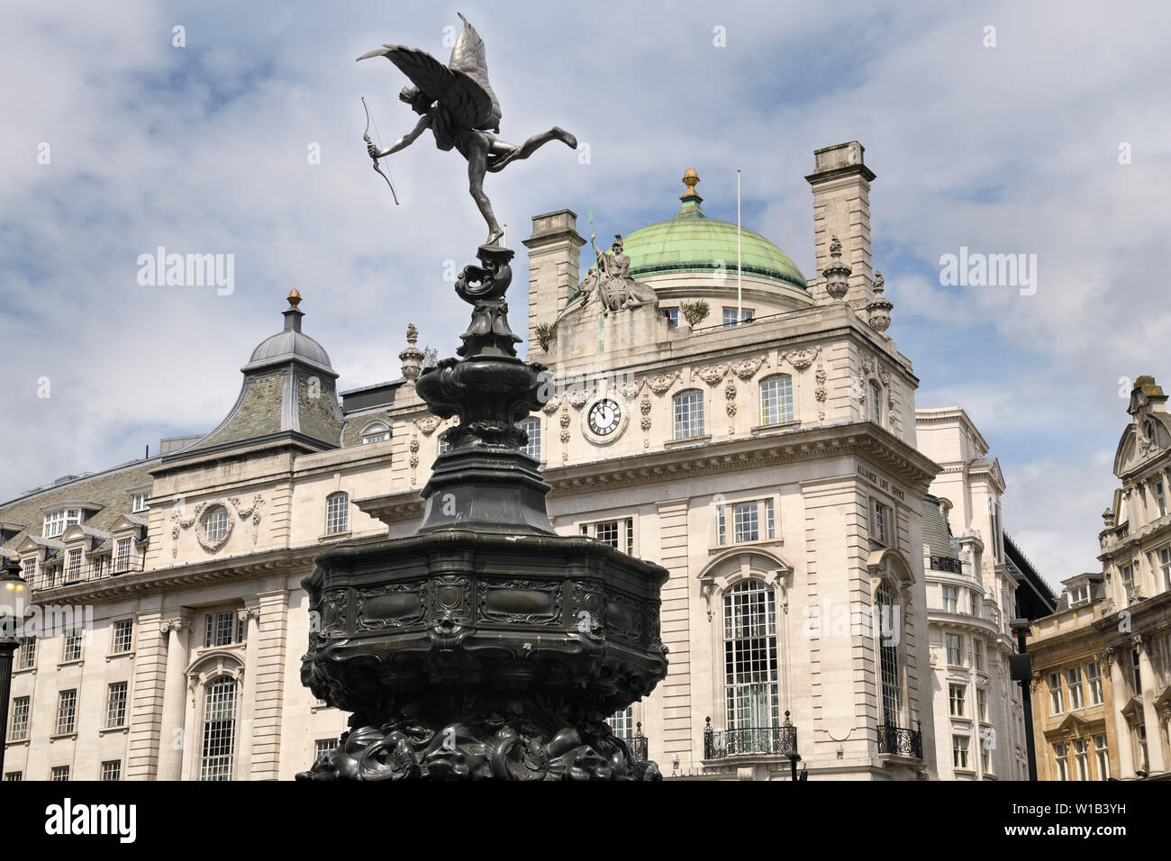 Shaftesbury Memorial Fountain with winged Anteros in Piccadilly Circus with The County Fire Office of The Quadrant on Regent street London England Stock Photo