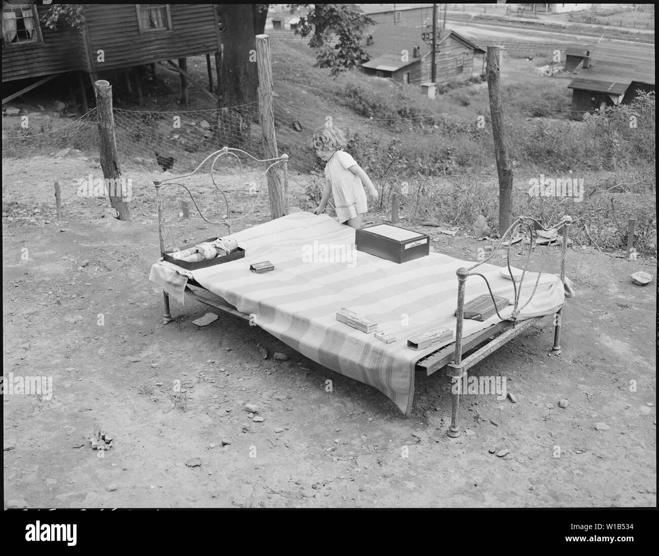 Bobbie Jean Sergent, coal loader's daughter, playing. P V & K Coal