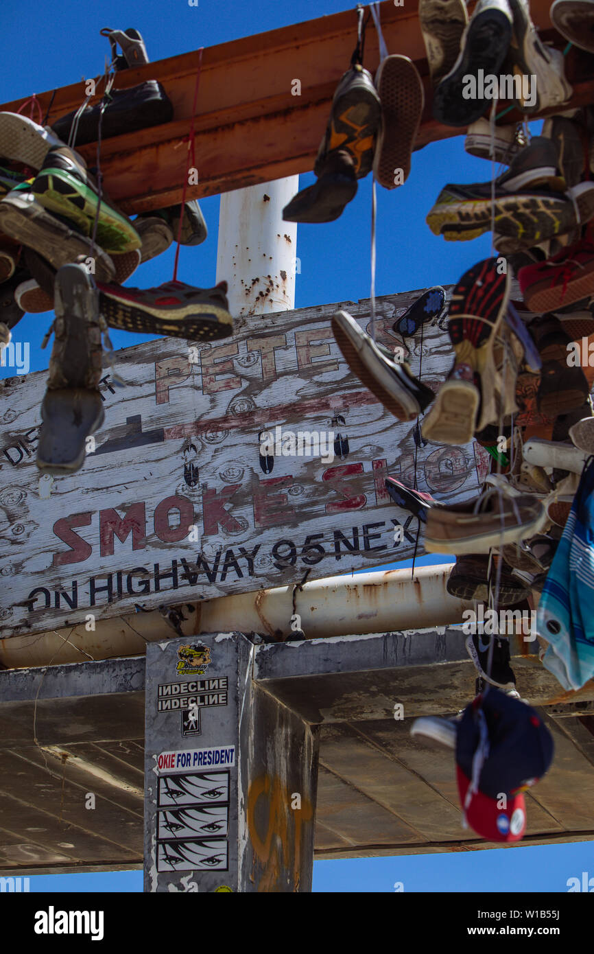 Old demolished Gas Station sign with hanging shoes on Highway 62, Rice ...
