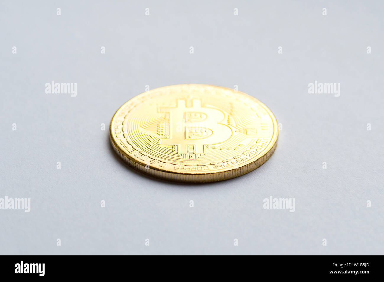 Golden bitcoin on white background. Concept mining. Copyspace Stock Photo