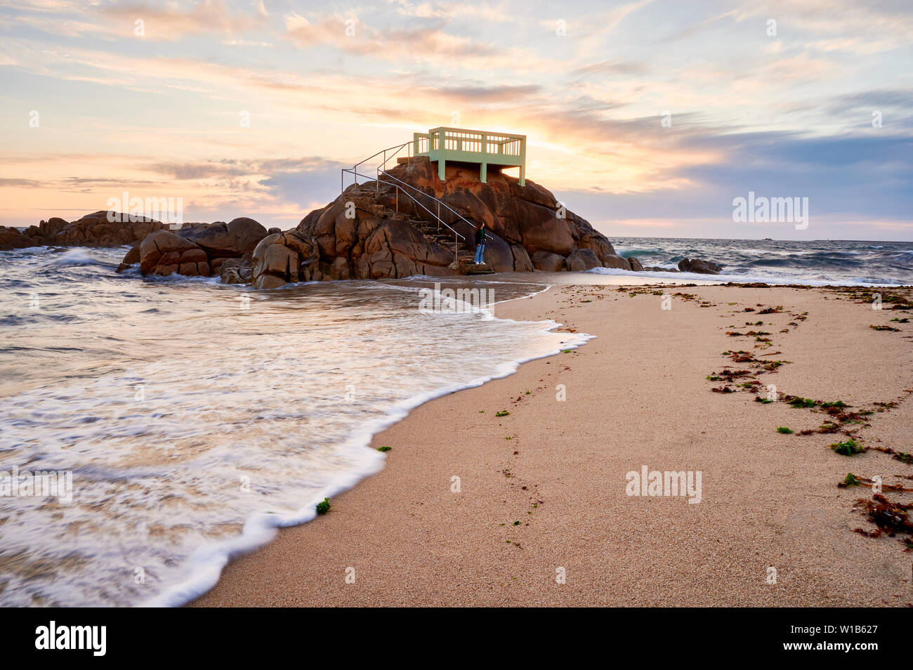 View point or gazebo over the rocks on a beach in Vila do Conde, Portugal, at sunset. Stock Photo