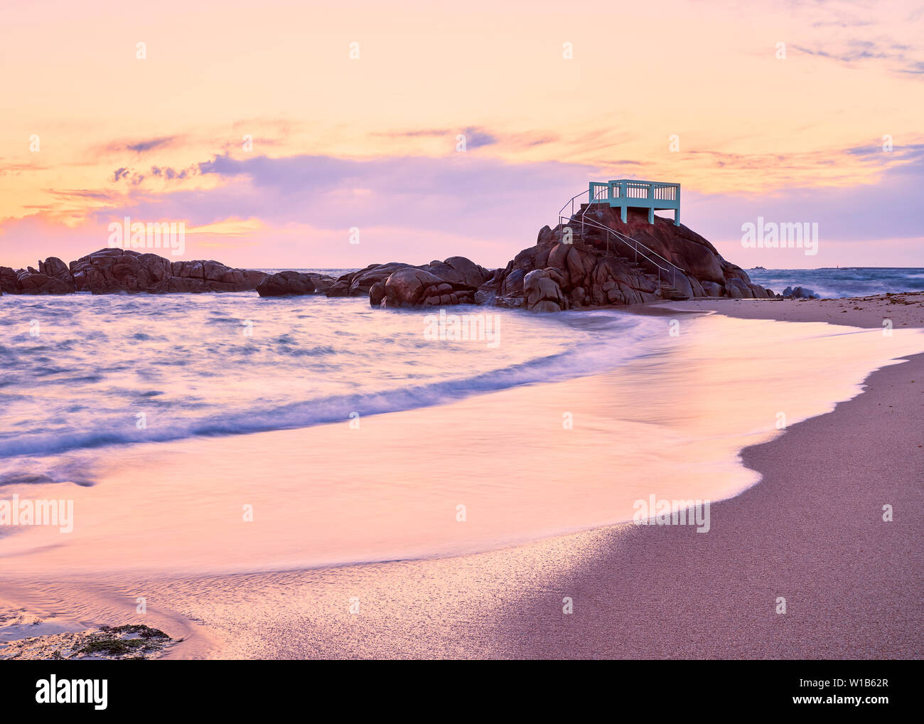 View point or gazebo over the rocks on a beach in Vila do Conde, Portugal, at sunset. Stock Photo