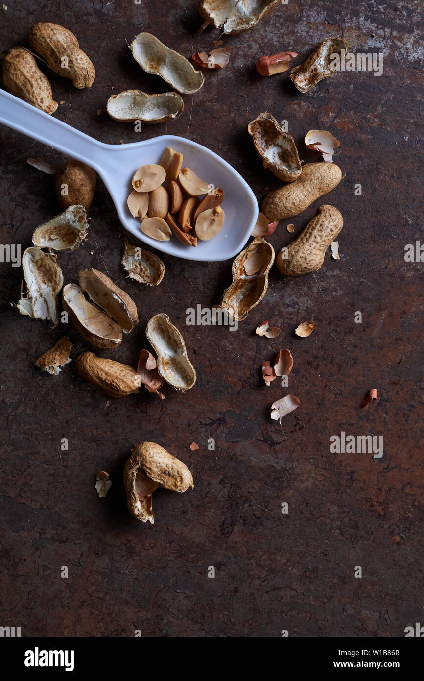 Peeled peanut on the rusty metal floor Stock Photo