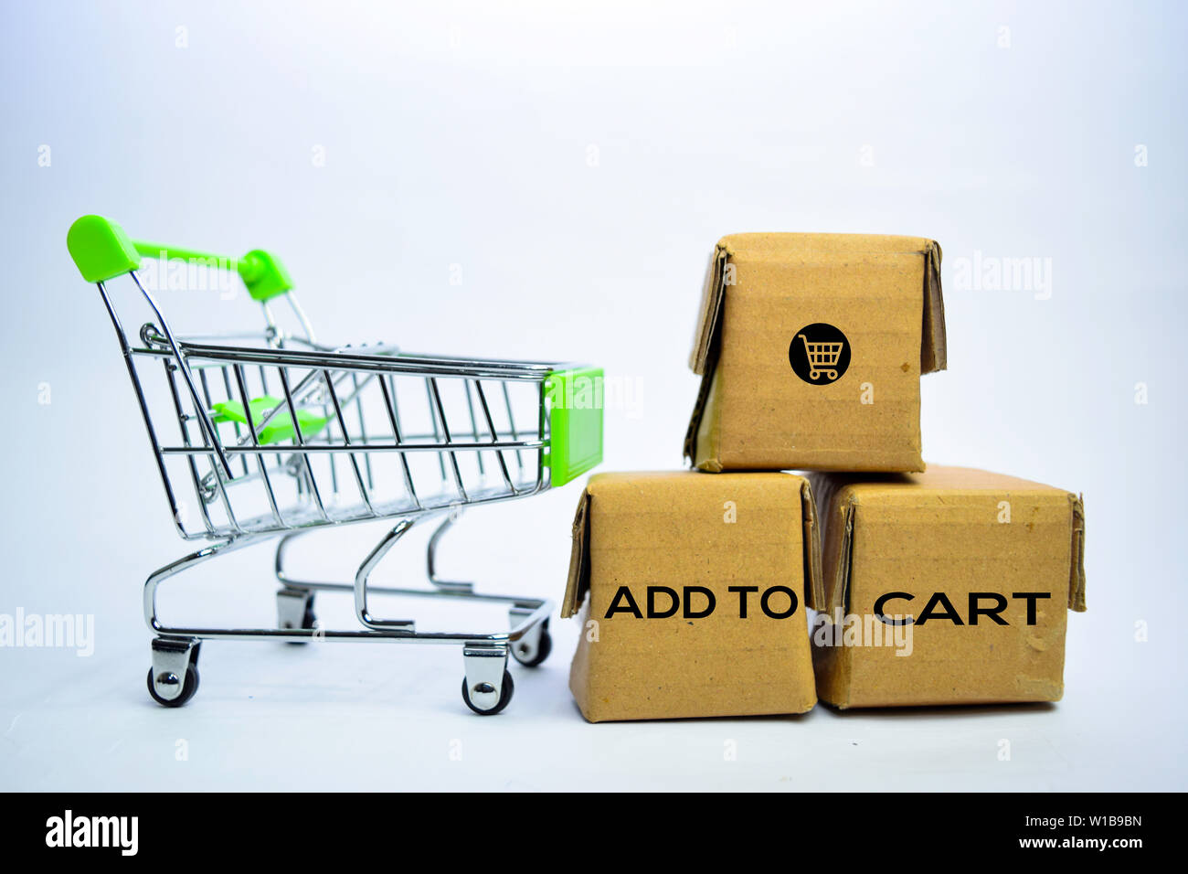Add To Cart Text in small boxes and shopping cart. Concepts about online  shopping. Isolated on white background Stock Photo - Alamy