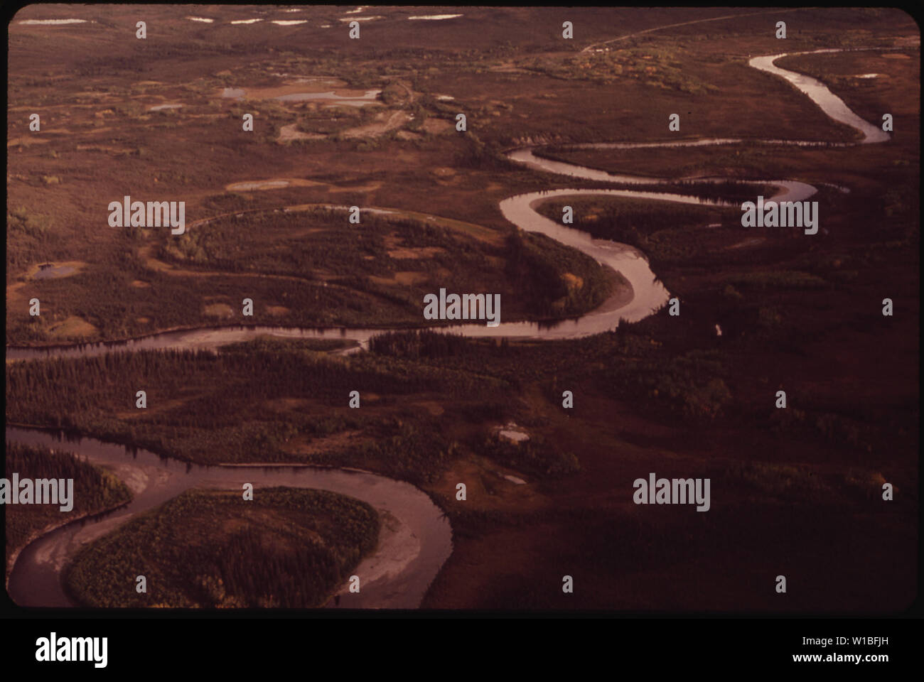 CROSSING THE WEST FORK OF THE GULKANA RIVER. VIEW SOUTHEAST HERE THE