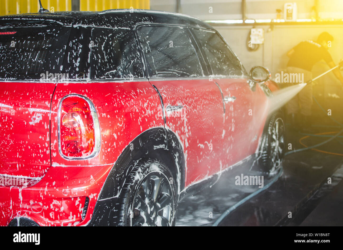 Red car wash with foam Stock Photo Alamy