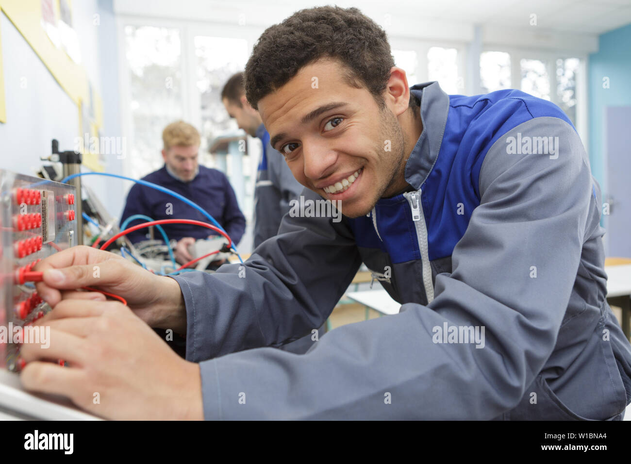 portrait of technician removing server cables Stock Photo