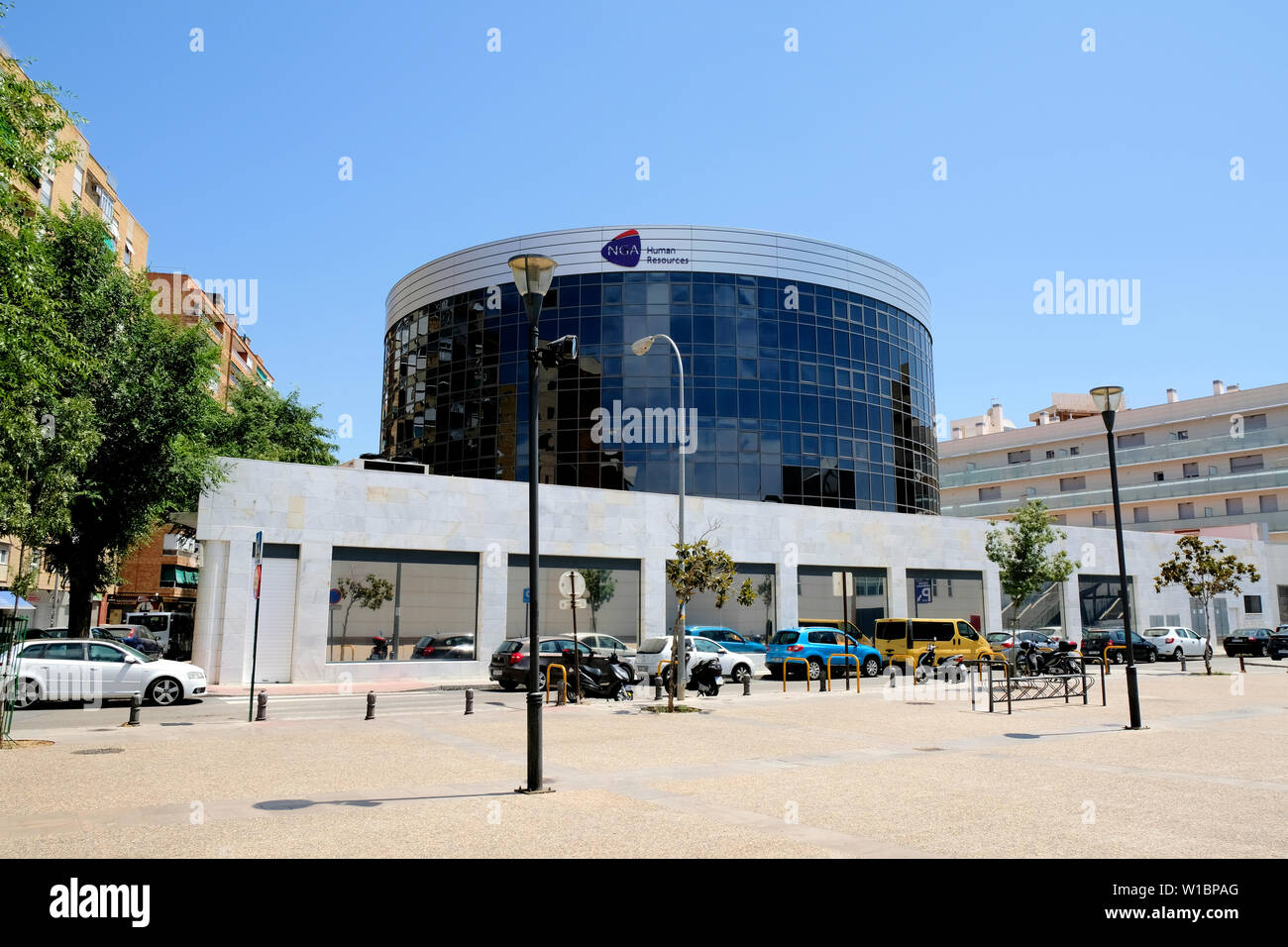 Exterior view of the NGA Human Resources building in Granada, Spain on a clear sunny day; HR consulting, and payroll services in Spain and Europe. Stock Photo