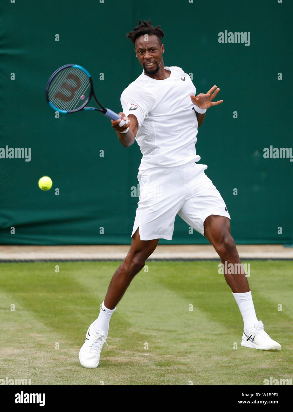 London, Britain. 1st July, 2019. Gael Monfils of France returns a shot  during the men's singles first round match against Ugo Humbert of France at  the 2019 Wimbledon Tennis Championships in London,