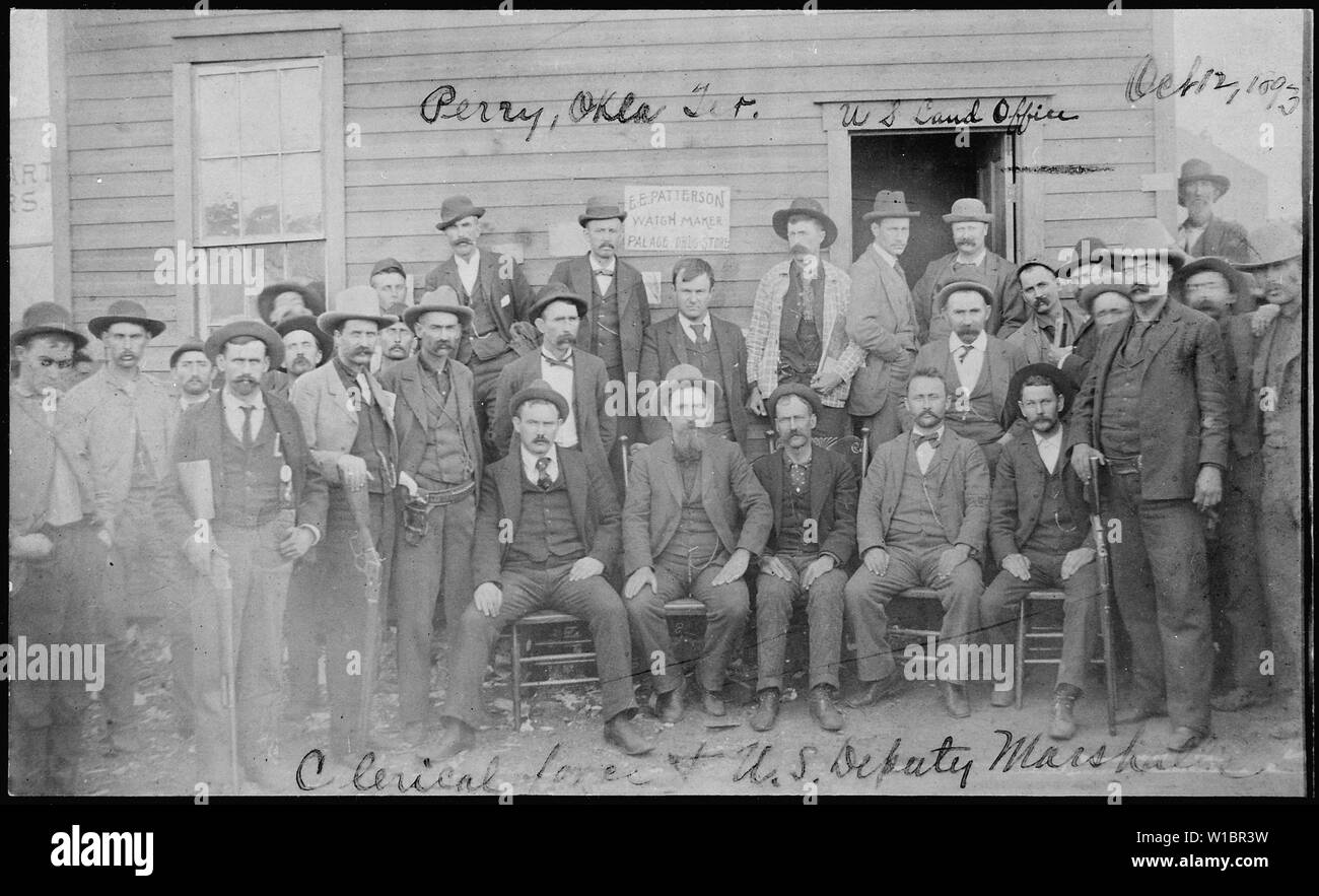 Clerical force & U.S. Deputy Marshalls, U.S. Land Office, Perry, OkIa