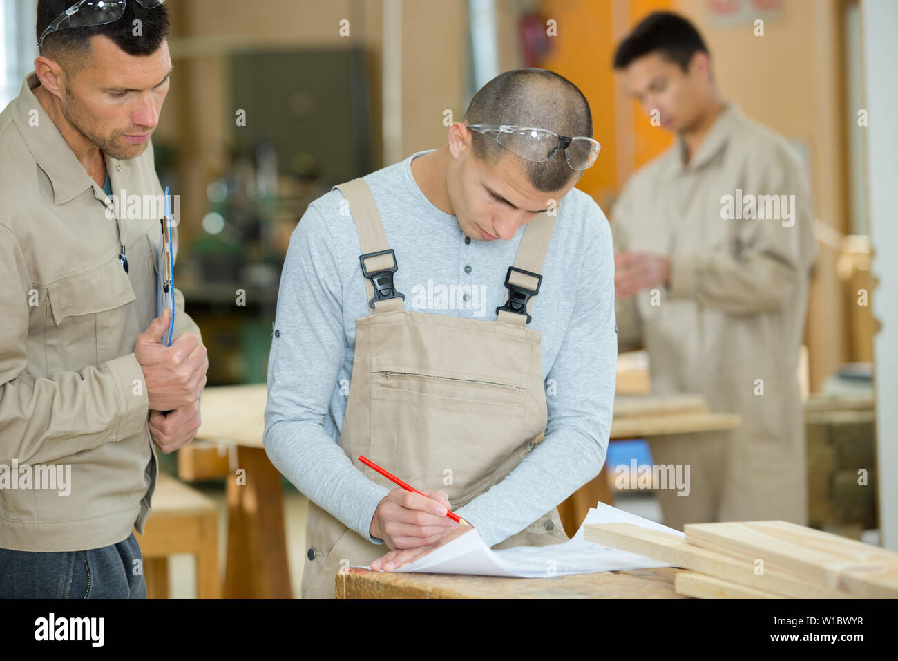two workers working in the furniture factory Stock Photo Alamy