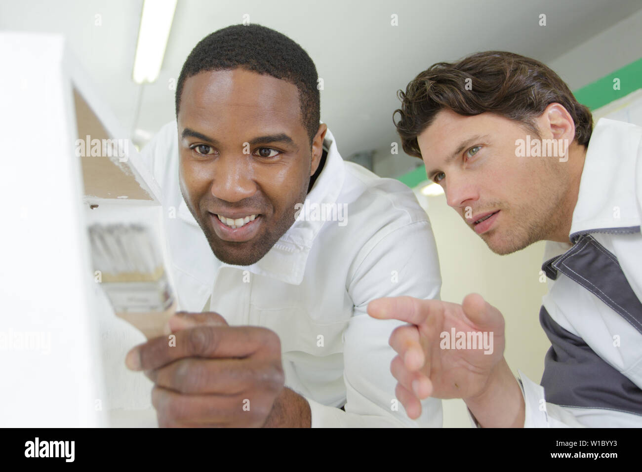 a painter with an apprentices Stock Photo