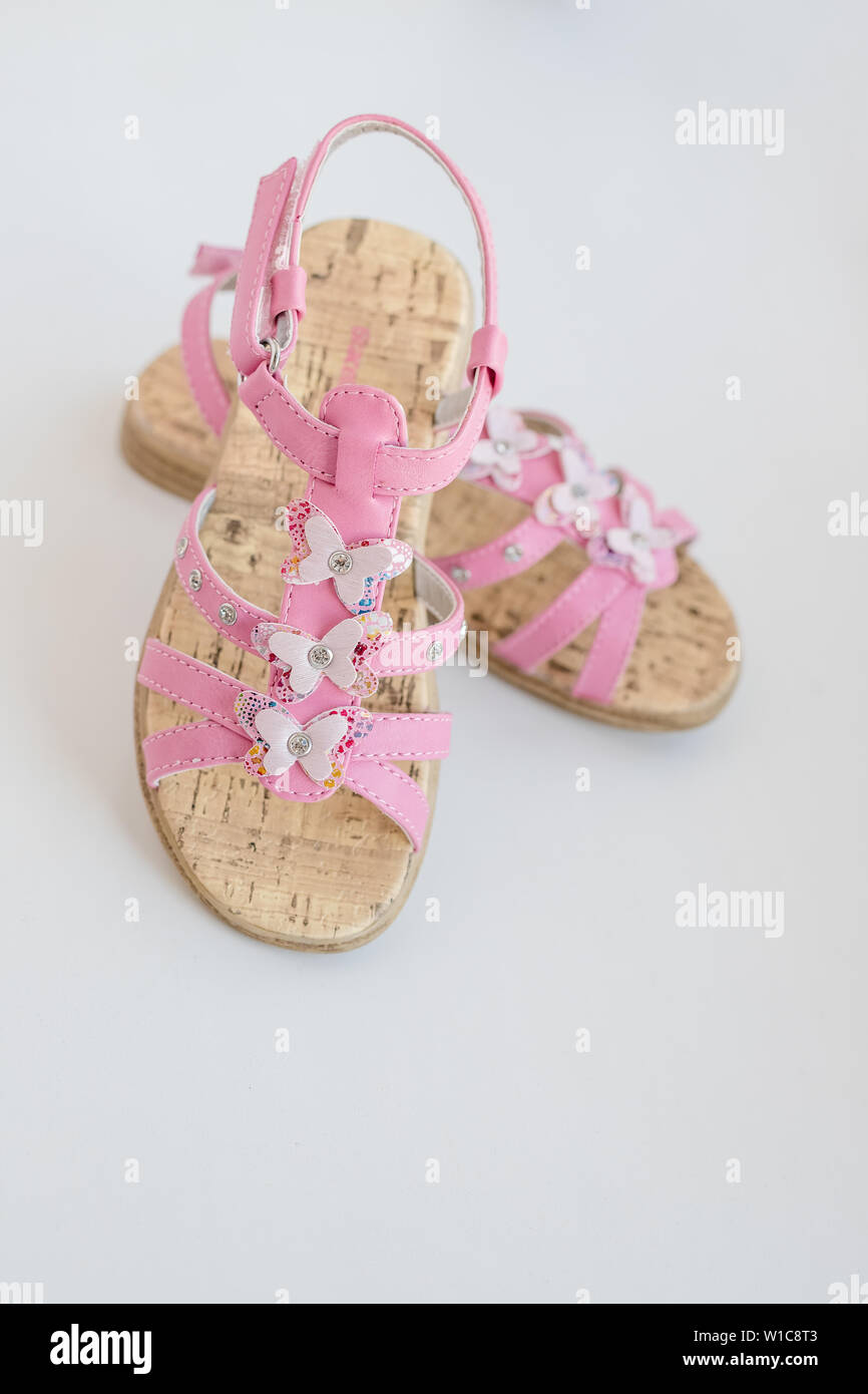 Pink baby girl summer sandals with butterfly isolated on a white  background. Trendy comfortable shoes for summer. Toddler fashion flip flops.Pair  of Stock Photo - Alamy