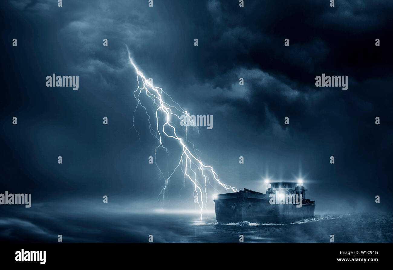 Boat in the thunderstorm in the ocean Stock Photo Alamy