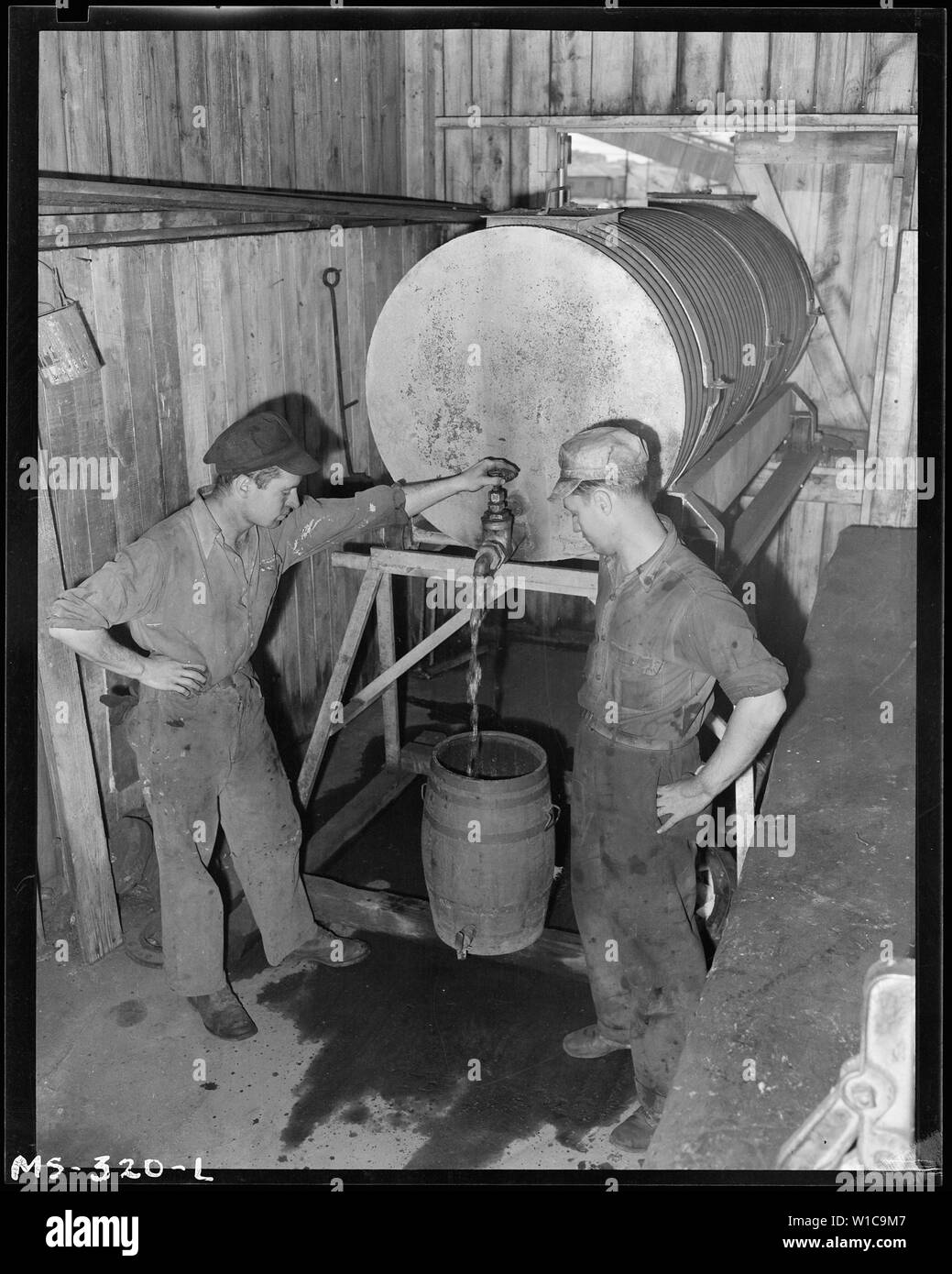 Drinking water for mine is trucked in. Tanks are then pushed on platform inside building, where water is drawn from them. Pyramid Coal Company, Victory Mine, Terre Haute, Vigo County, Indiana. Stock Photo