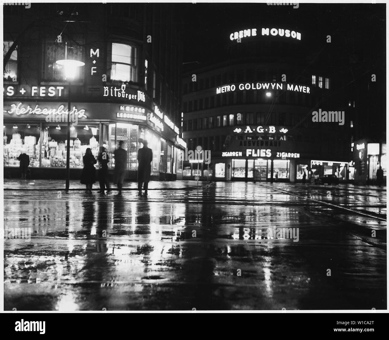Dusseldorf, Germany. A rainy night and glistening lights combine to make a pleasent scene of the main shopping area of Dusseldorf, one of the three cities in the Ruhr with more than half-a-million people. The others are Essen and Dortmund Stock Photo