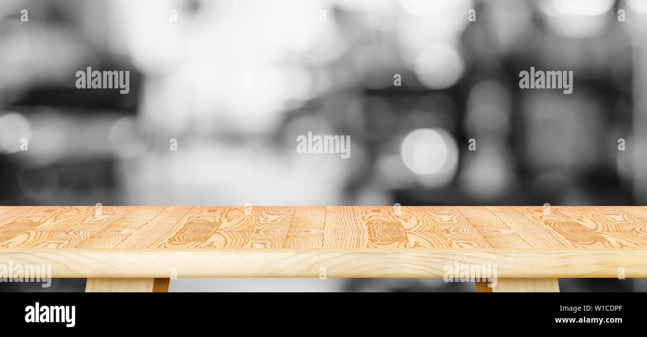 Empty Wood Table Top With Blurred Black And White Cafe Background