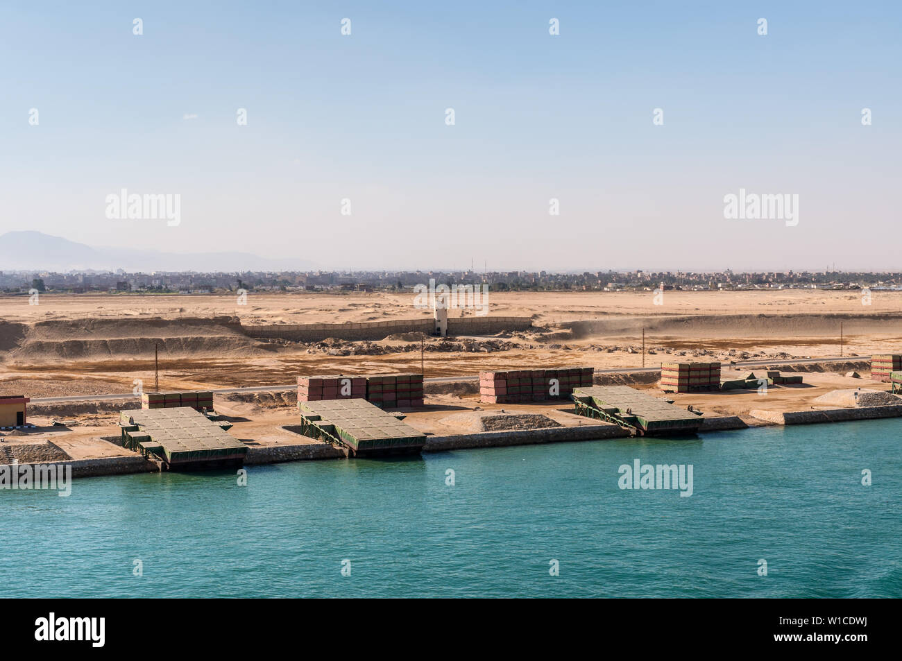 Suez, Egypt - November 5, 2017: Pontoons bridge for crossing the Suez Canal lie on the shore of canal near Suez, Egypt. Stock Photo