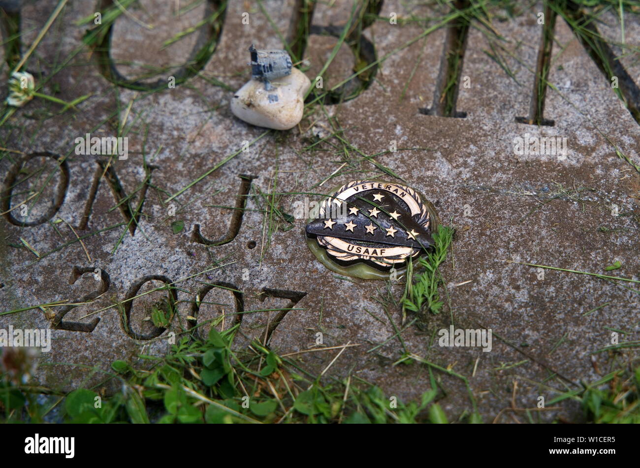 A USAAF or United States Army Air Forces pin glued to a World War II veterans grave marker. Stock Photo