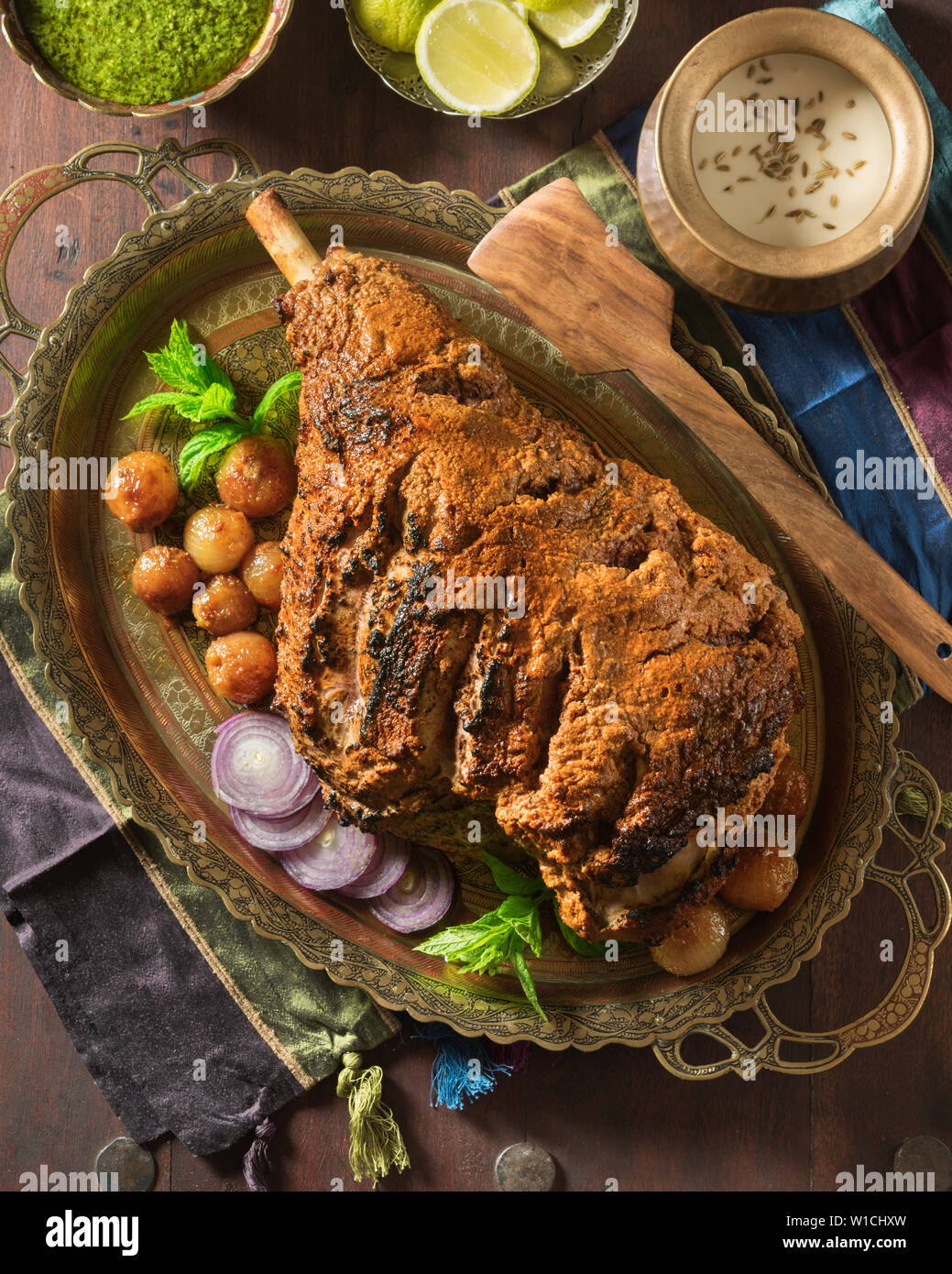 Raan masaledar. Roast spiced leg of lamb. India Food Stock Photo Alamy