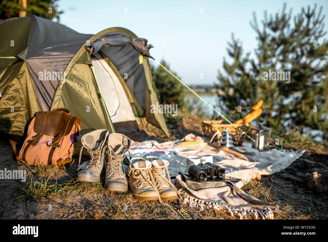 Campsite With Tent Trekking Shoes Backpack Plaid In The Forest Stock Photo Alamy