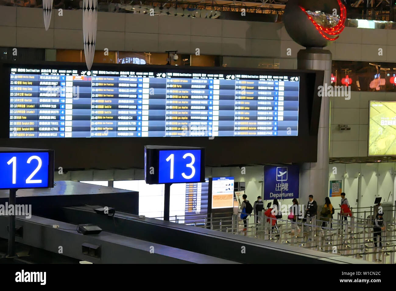 Top shot of passengers going to the check in desks inside Taiwan airport Stock Photo