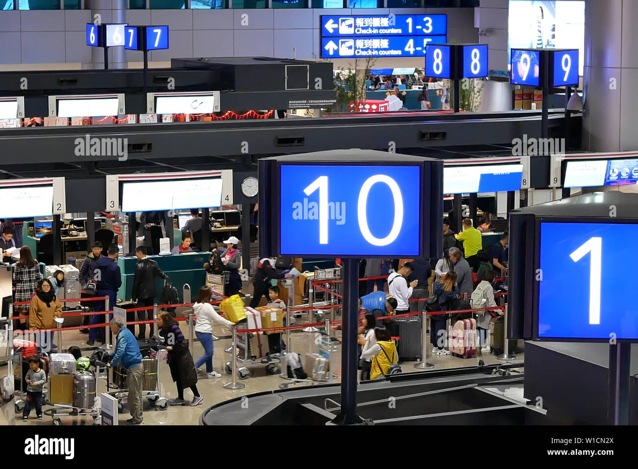 Top shot of passengers going to the check in desks inside Taiwan airport Stock Photo