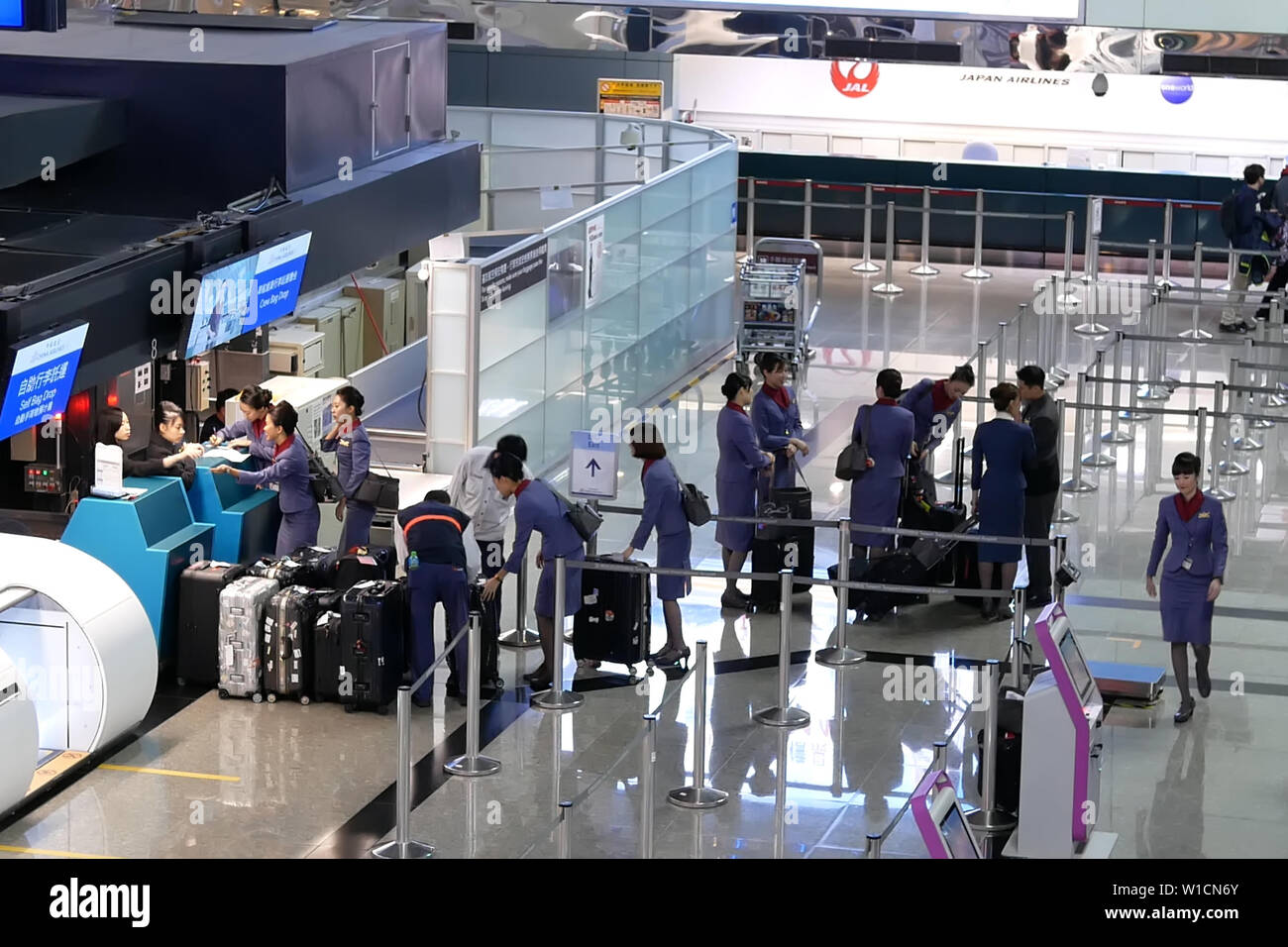 Top shot of passengers going to the China airline check in desks inside Taiwan airport Stock Photo