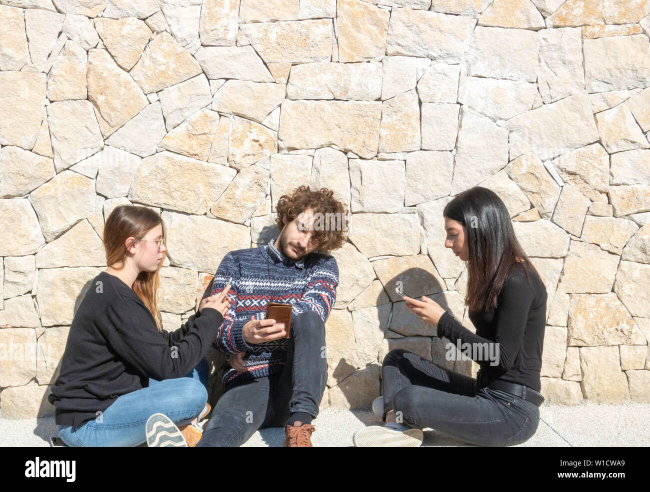 Social issue: Isolation due to addictive use of smartphones, connected way of life Stock Photo