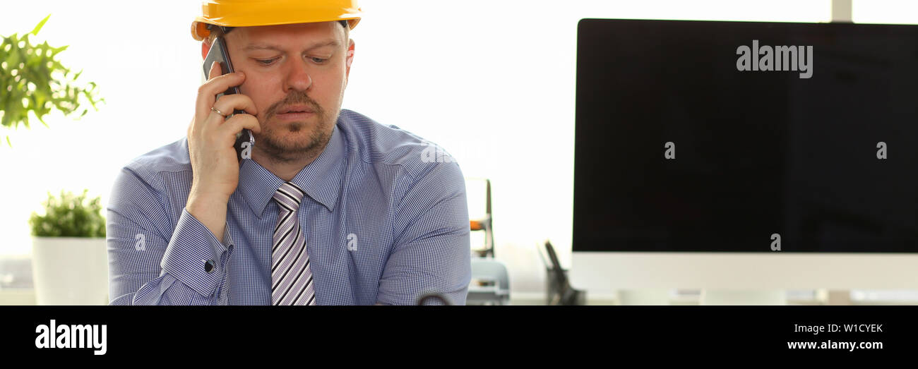Caucasian Engineer Working on House Blueprint Stock Photo