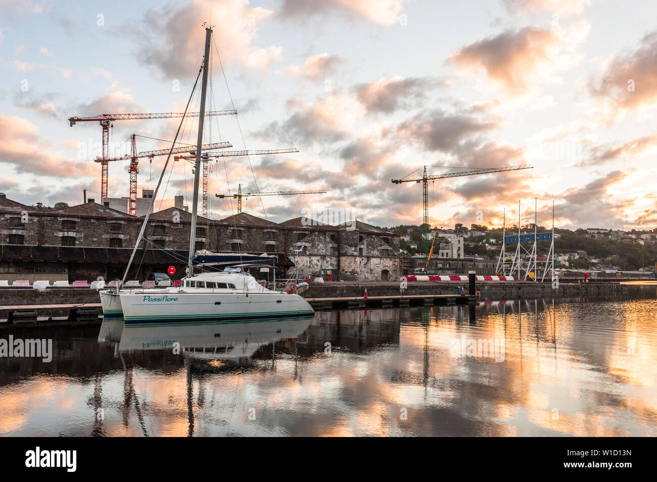 Cork City, Cork, Ireland. 02nd July, 2019. French catamaran Passiflore tied up at custom house quay before dawn, against a backdrop of city developments at Penrose wharf and Horgan's Quay in Cork City, Ireland. Credit: David Creedon/Alamy Live News Stock Photo
