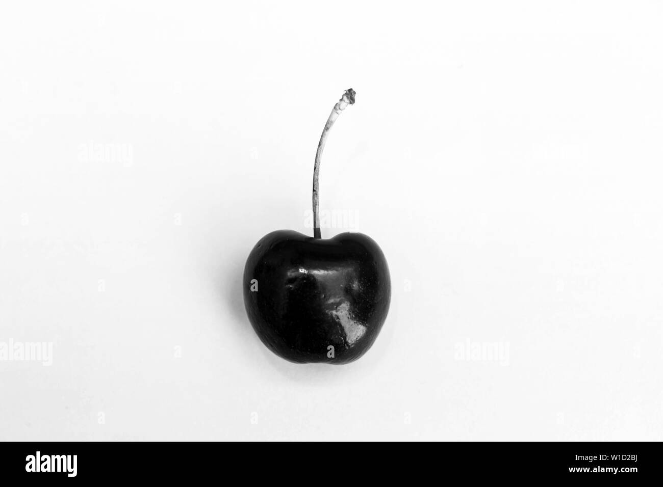 Cherry fruit Isolated on black and white background. beautiful pink concept top view Stock Photo