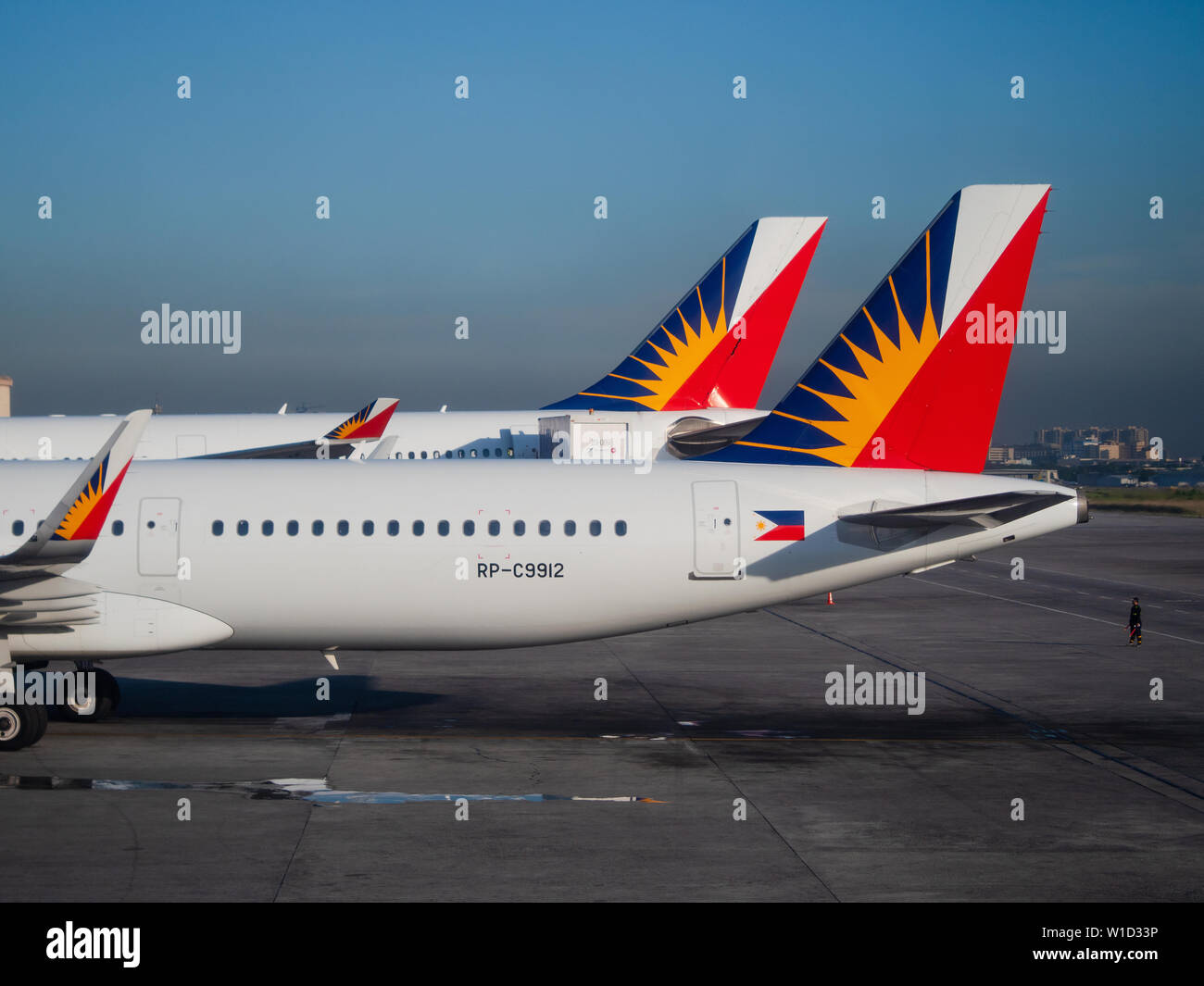 Manila, the Philippines - March 28, 2019: Two Philippine Airlines airliners, an Airbus A320 and an Airbus A330, at Ninoy Aquino International Airport, Stock Photo