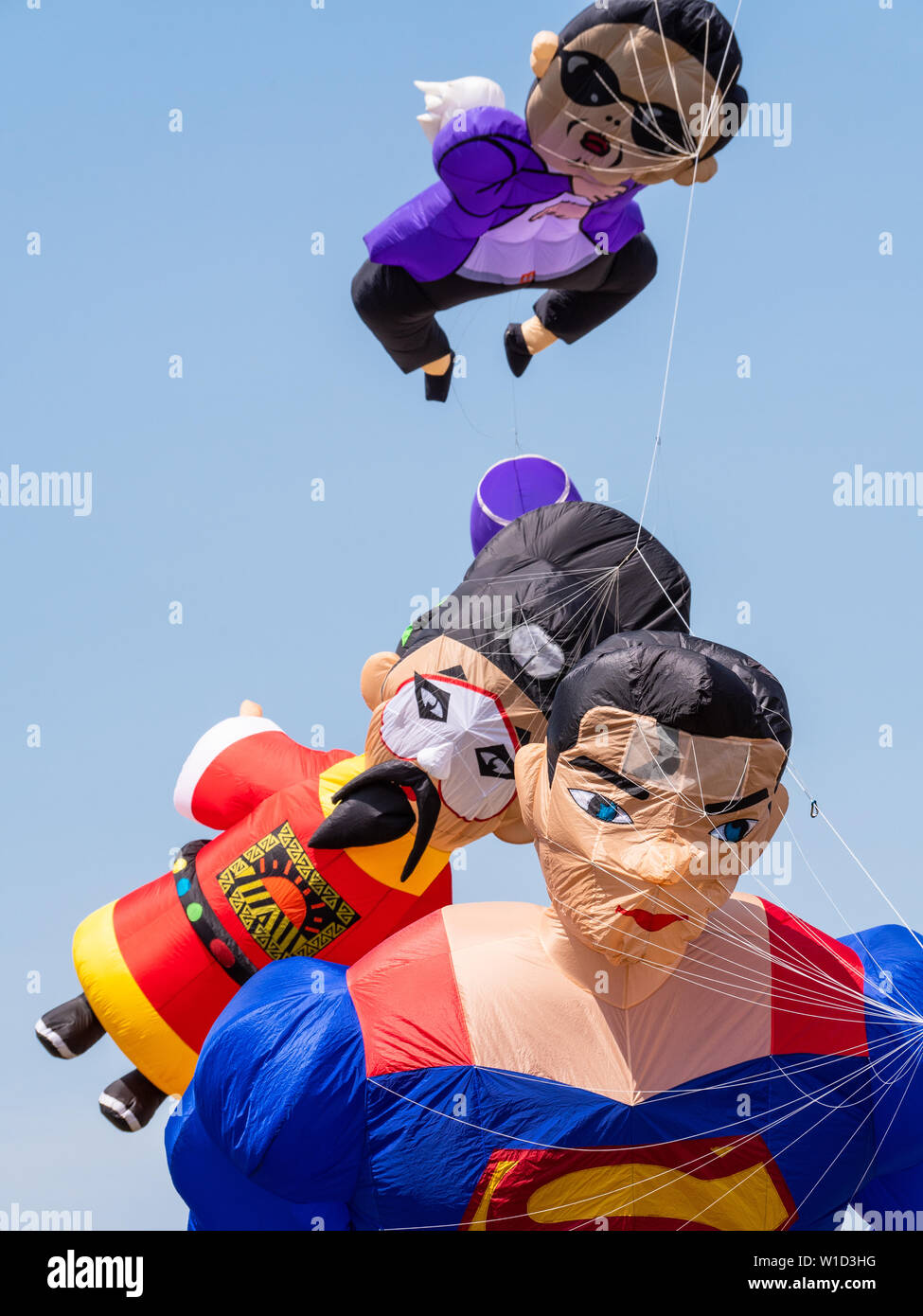 Pasir Gudang, Malaysia - March 3, 2019: Soft kites depicting Superman, an ancient Chinese king and Korean artist Psy, flying at the 24th Pasir Gudang Stock Photo