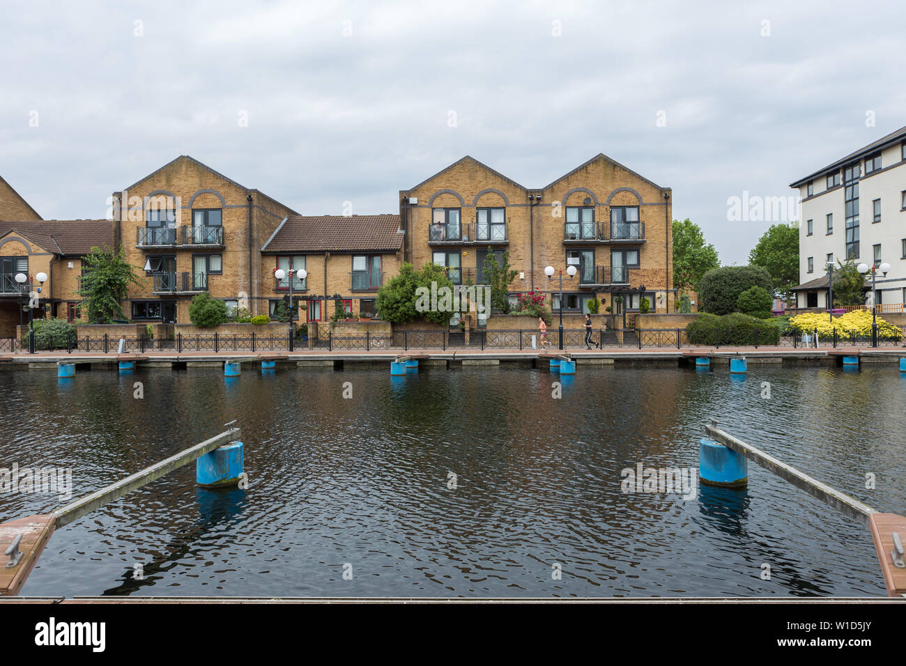 Residential houses and private mooring on the Isle of Dogs Stock Photo