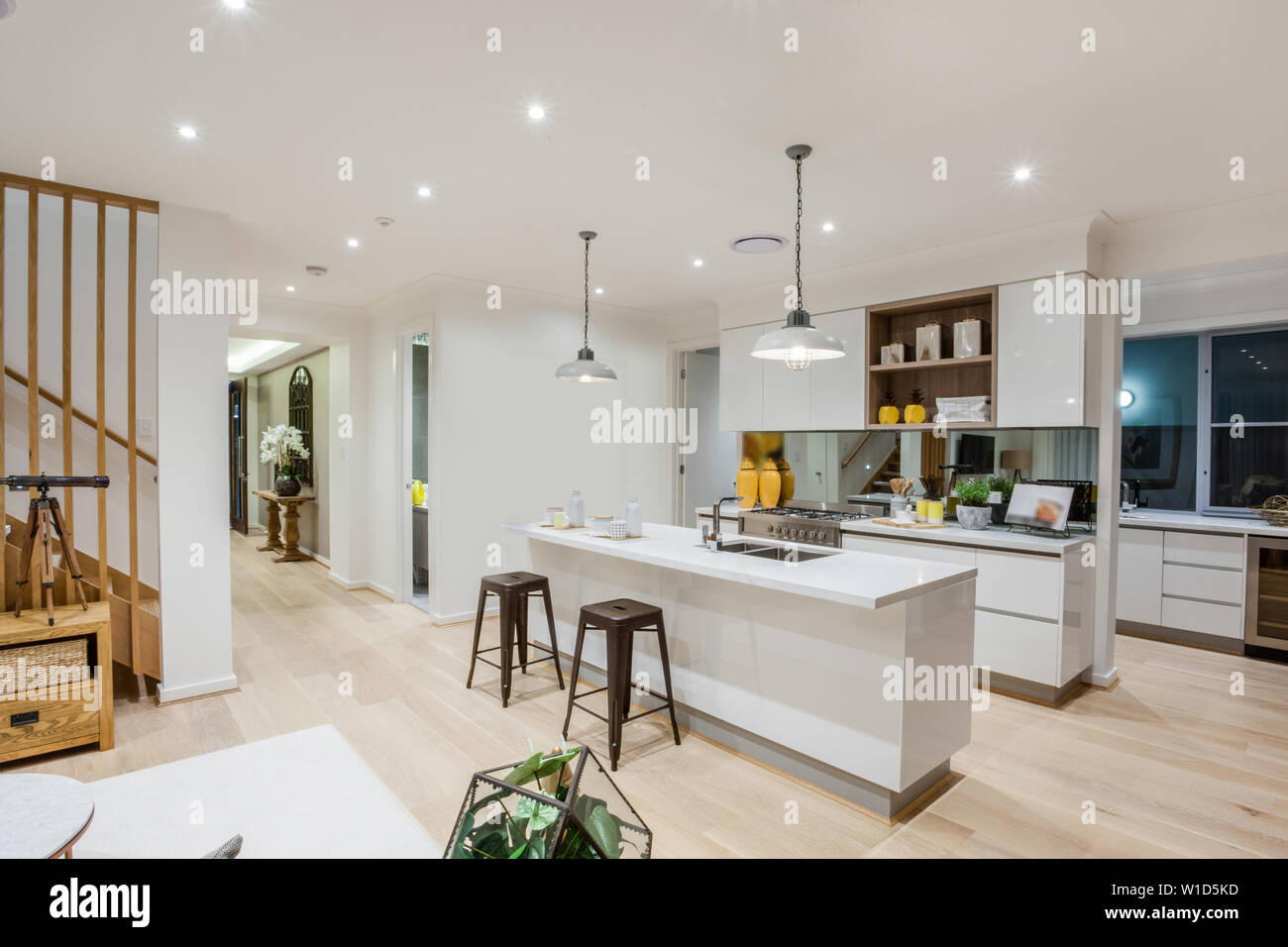 Stylish All White Kitchen Counters And Cabinets With A Snack