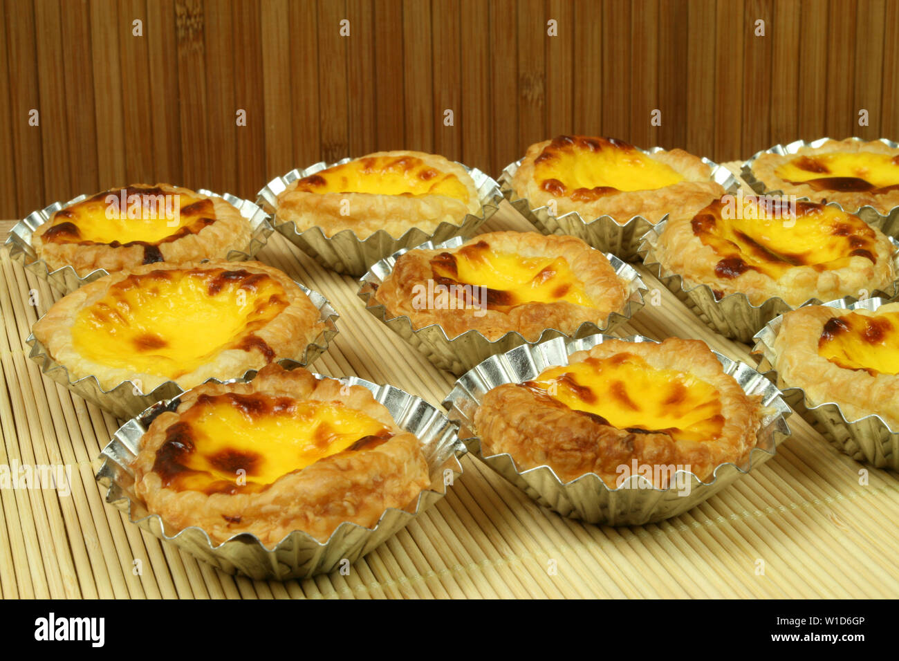Traditional portugese egg tarts pastries pasteis de nata in tin