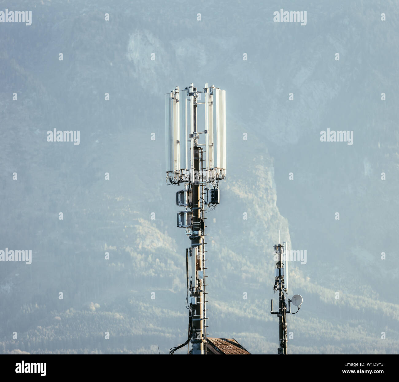 Communication transmitter on the rooftop of a house Stock Photo Alamy