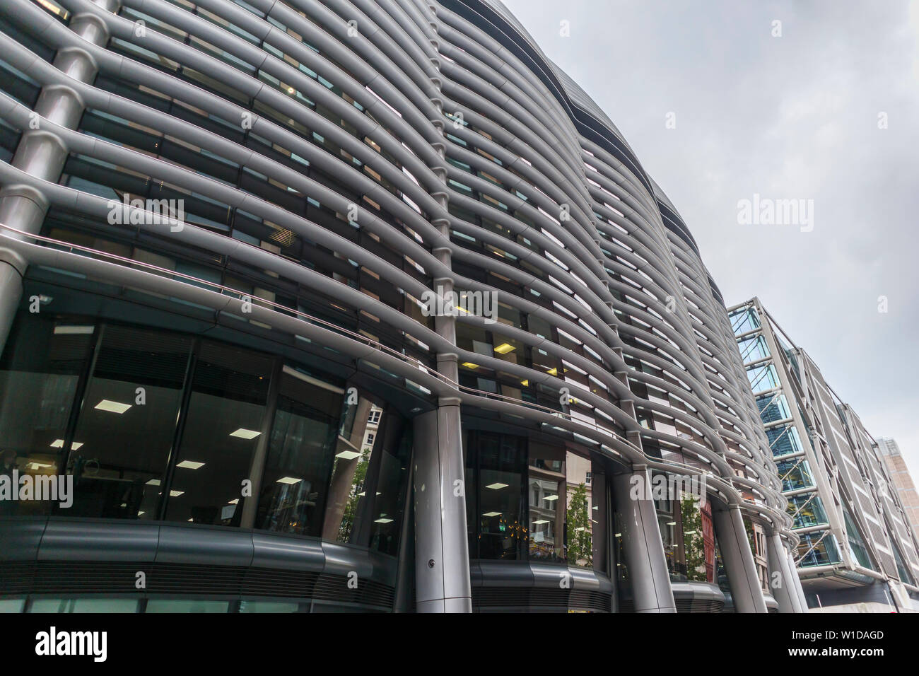 Curved solar shading (brise soleil) panels on the side wall of The