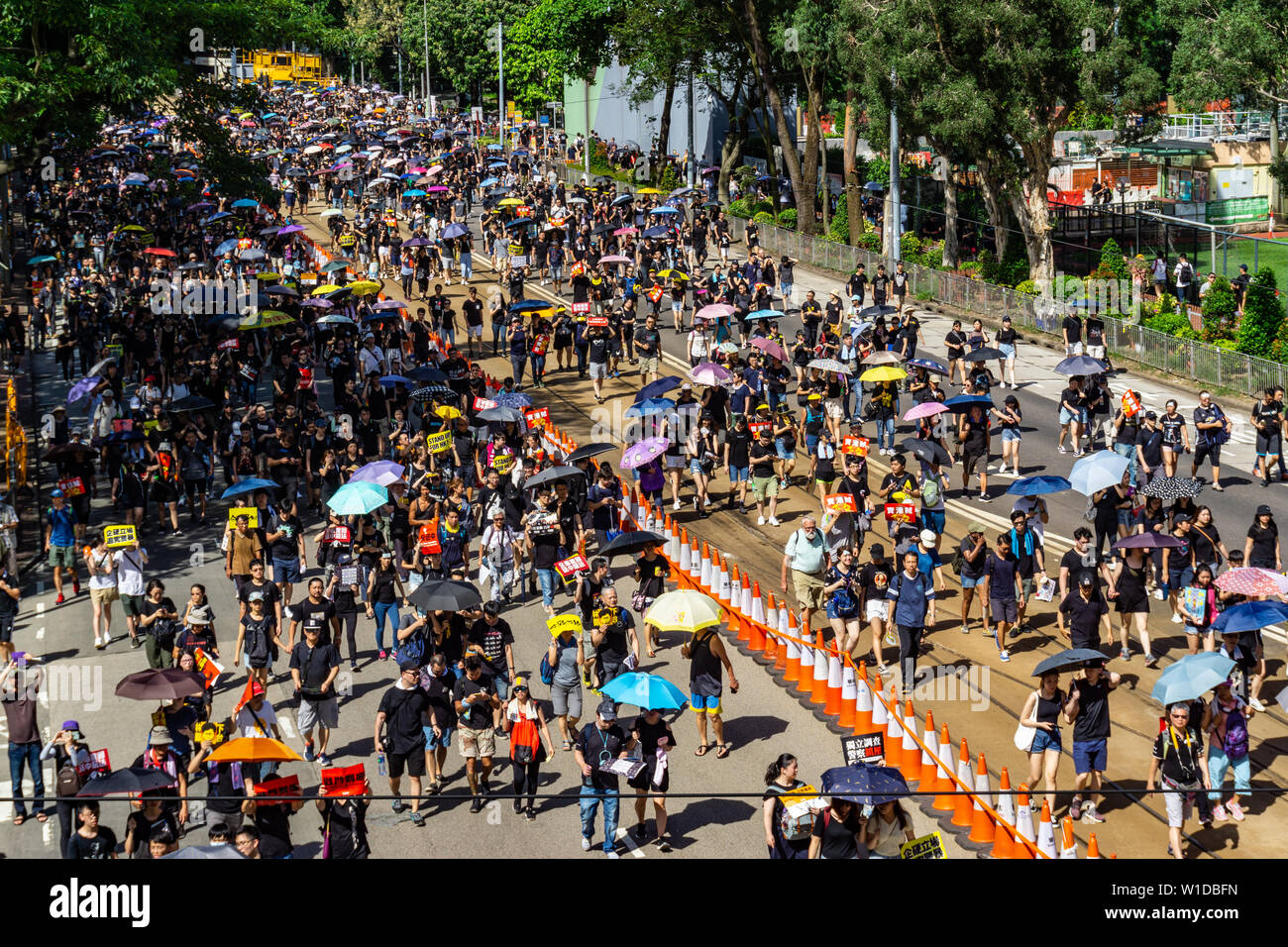 Hong Kong 2019 anti-extradition law protester march on July 1st, protesters carry umbrellas to protect themselves against the scorching sun Stock Photo