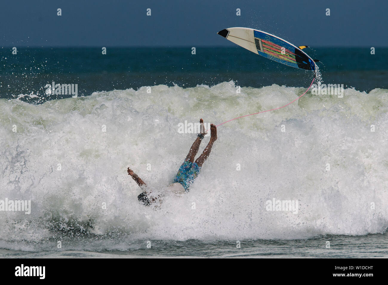 Surfer's crash on the high wave in Bali Stock Photo Alamy