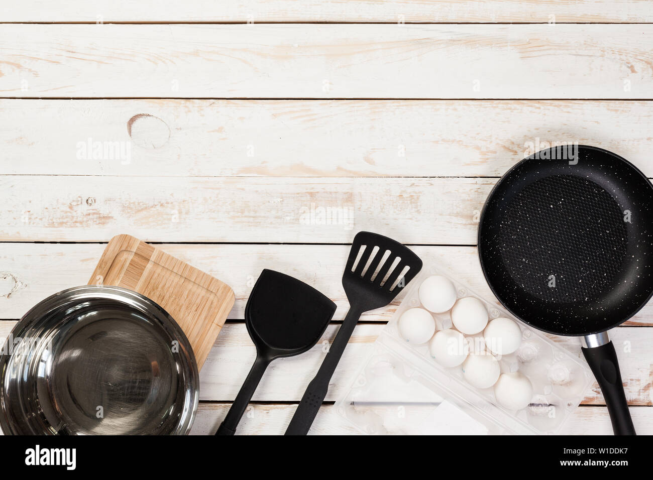 Cast Iron Pan And Other Kitchen Utensils On Wooden Table Top View Stock Photo Alamy