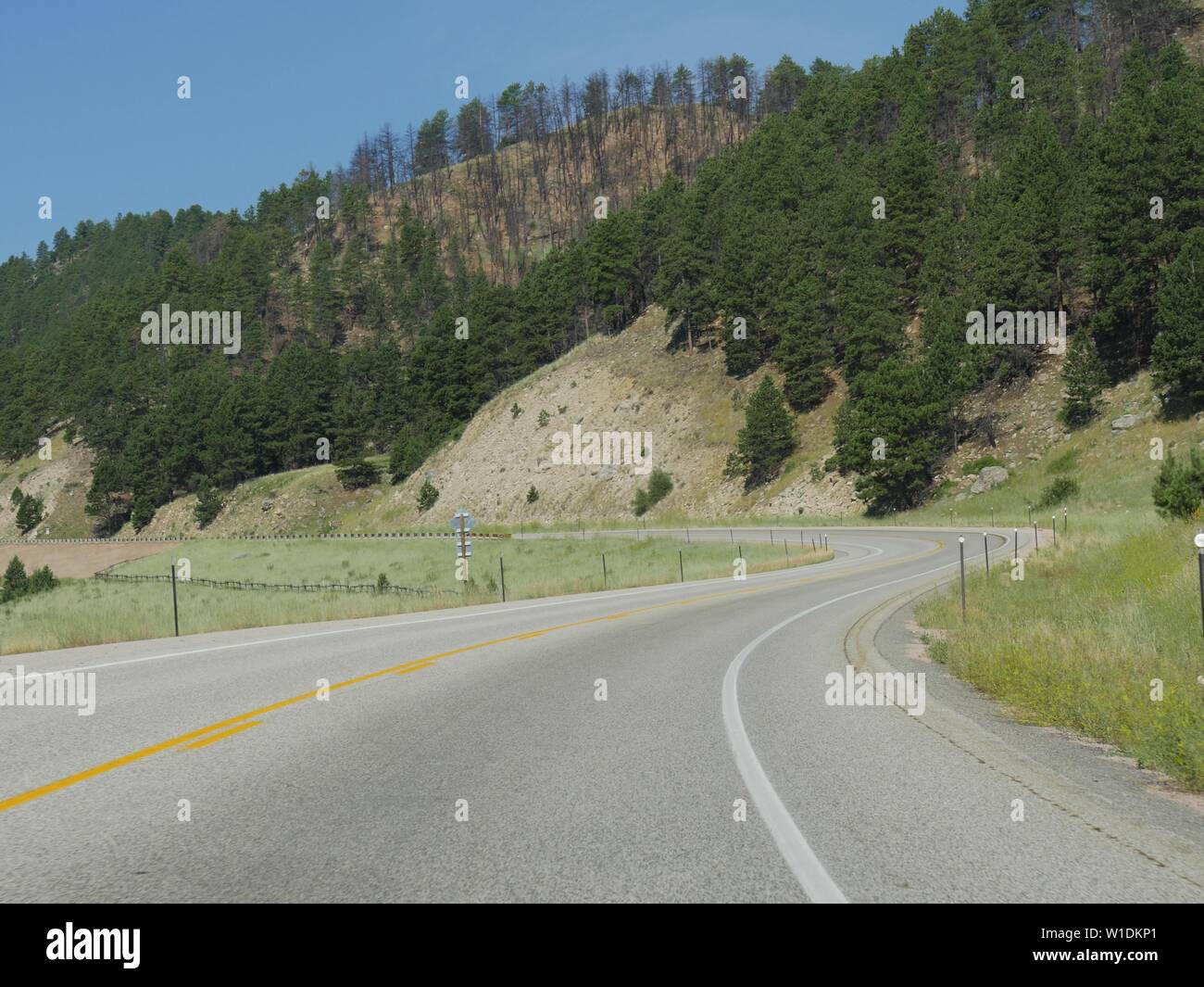 View along a scenic winding road at Interstate 90 in Wyoming Stock Photo - Alamy