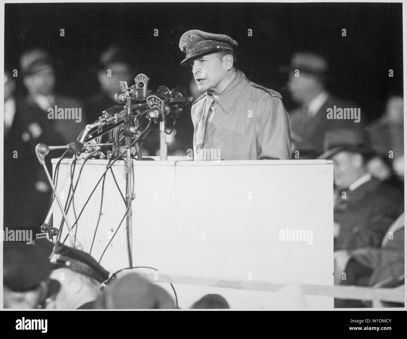 General Douglas MacArthur addressing an audience of 50,000 at Soldier's Field. The General, on his first visit to the United States in 14 years, April 1951. Chicago, Illinois. Acme.; General notes:  Use War and Conflict Number 1377 when ordering a reproduction or requesting information about this image. Stock Photo