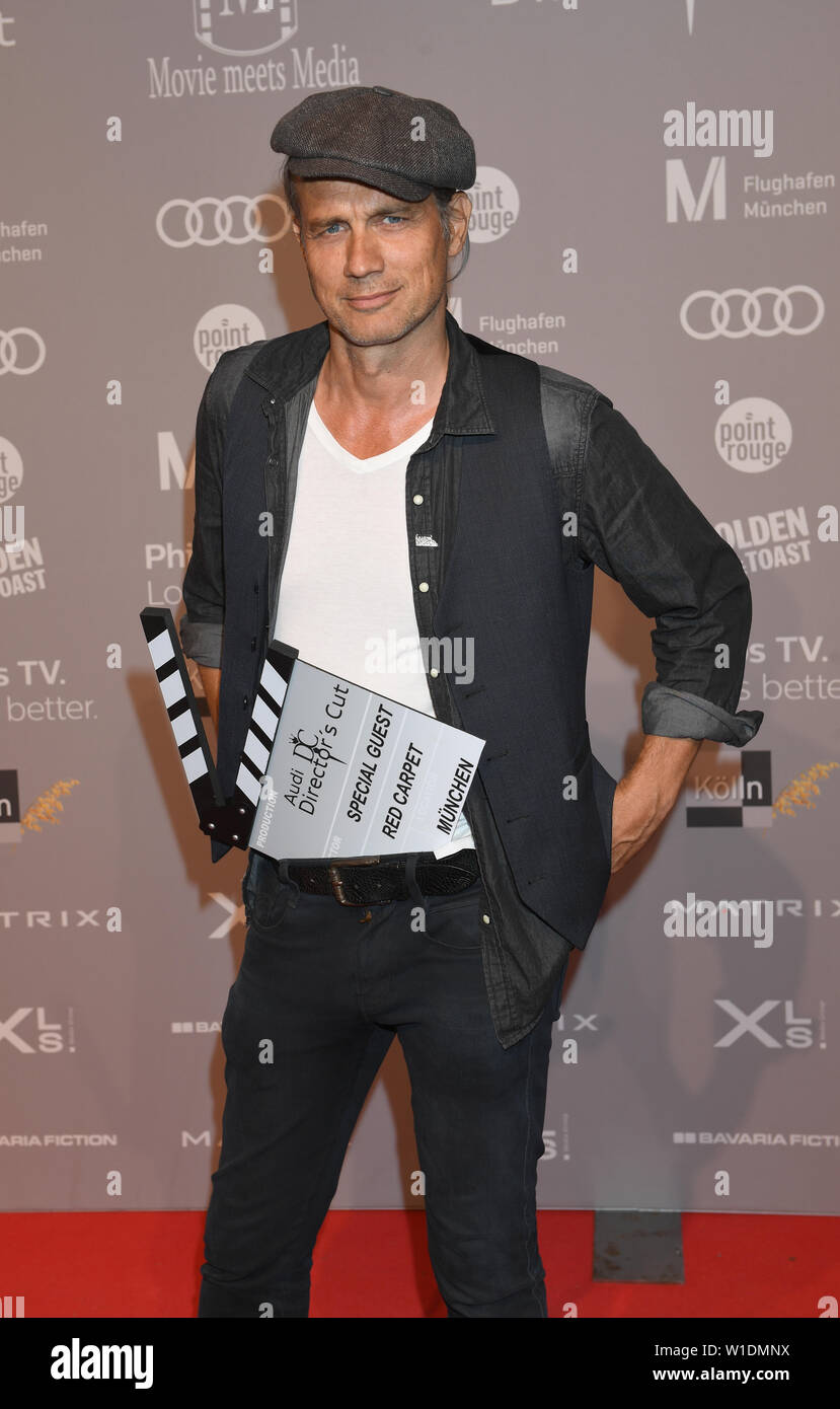 01 July 2019, Bavaria, Munich: The actor Ralf Bauer stands on the red ...