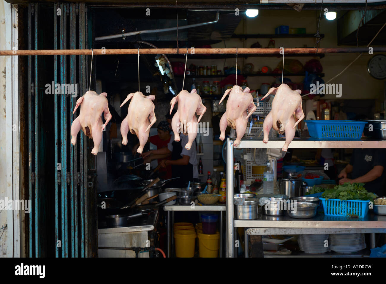 A line of chickens prepped for cooking at the back of a restaurant in downtown Miri, Borneo, Malaysia. Stock Photo