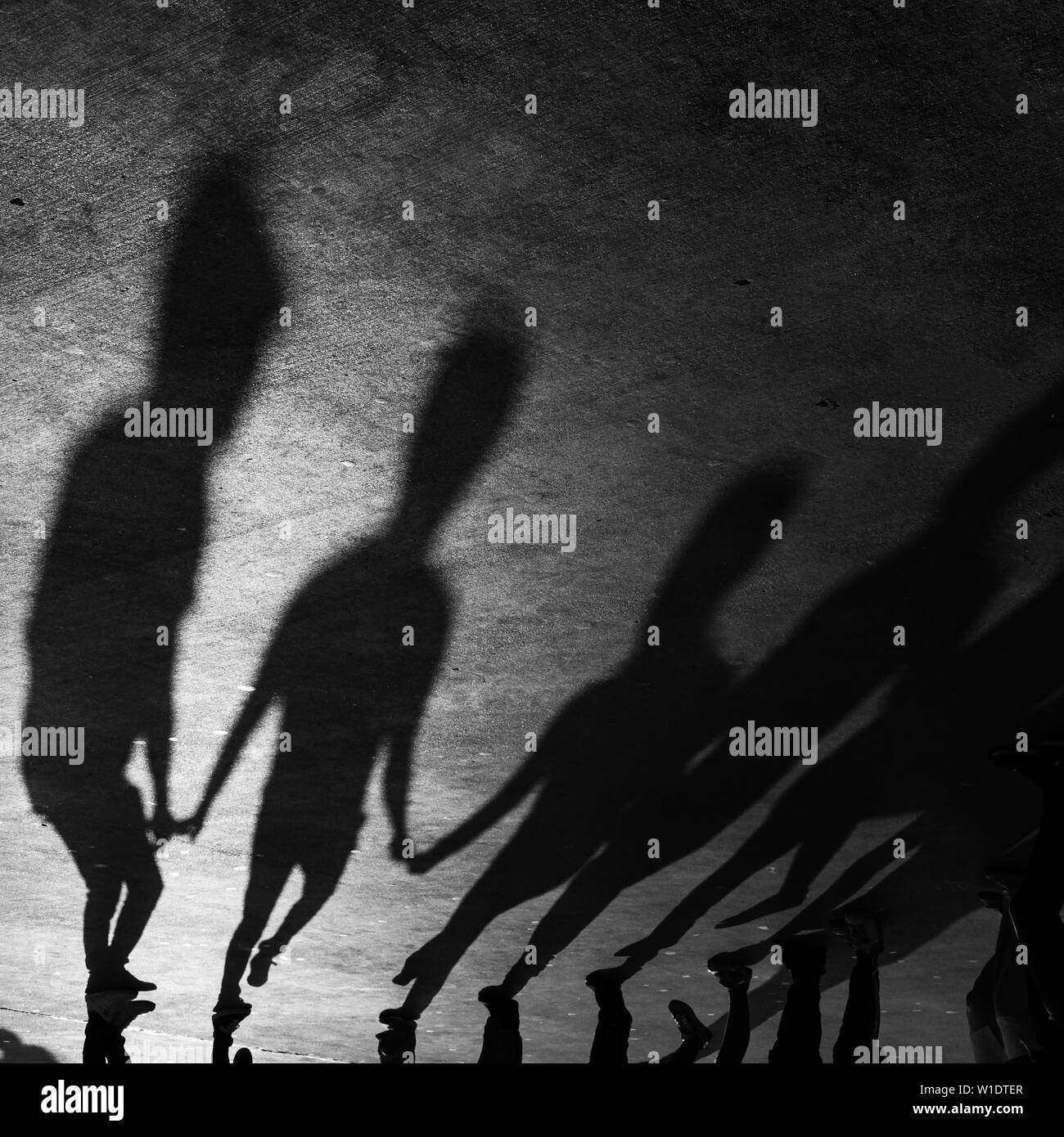 Shadows of folk dancers at outdoor Stock Photo